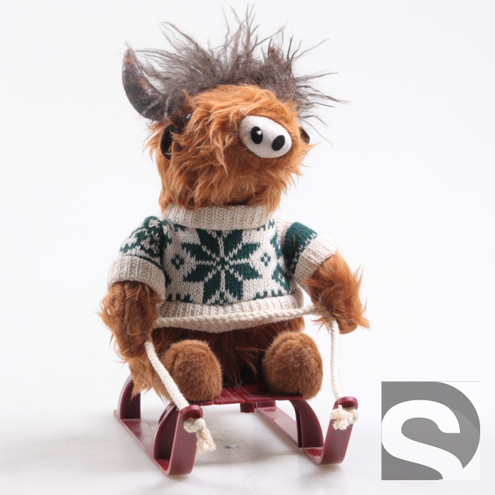 Vache Highland sur Luge 21x20x30cm
